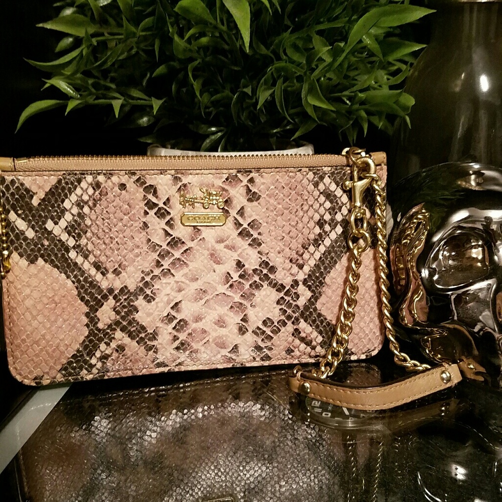 Embossed leather Coach wristlet